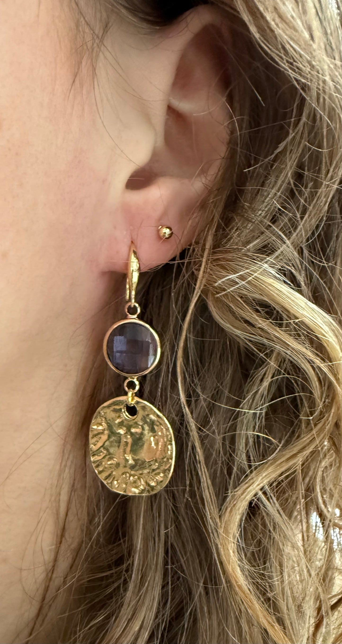 Doorzichtig paars facetsteentje met muntje