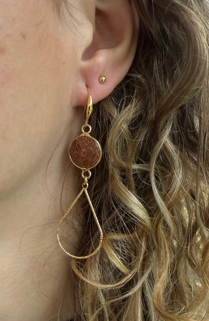 Ronde bruine glitter natuursteen met open druppel