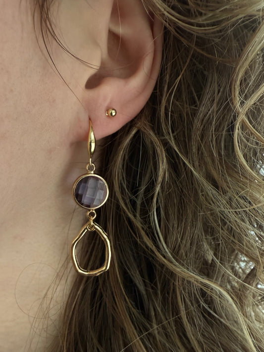 Doorzichtig paars facetsteentje met kleine hanger