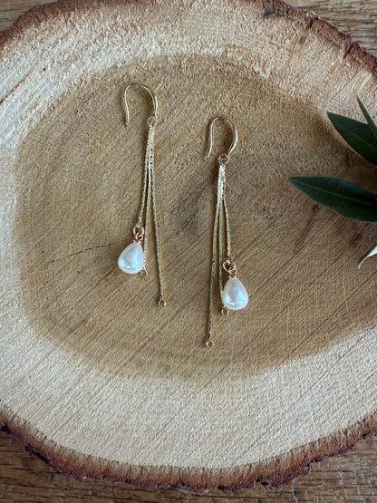 Lange oorbellen met pareltje