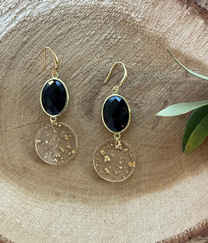 Zwarte steen met doorzichtige hanger met bladgoud